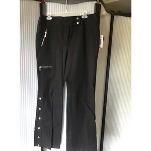Michael Kors stretch black jeans. Snaps on legs expand to flare. Unique,cool